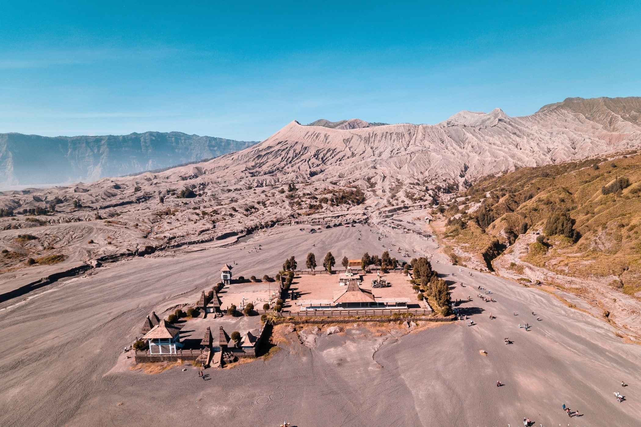 Sea of sand volcanic desert surrounding Mount Bromo crater