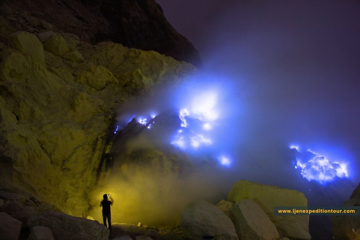 electric blue flames caused by burning sulfur gas at Ijen crater