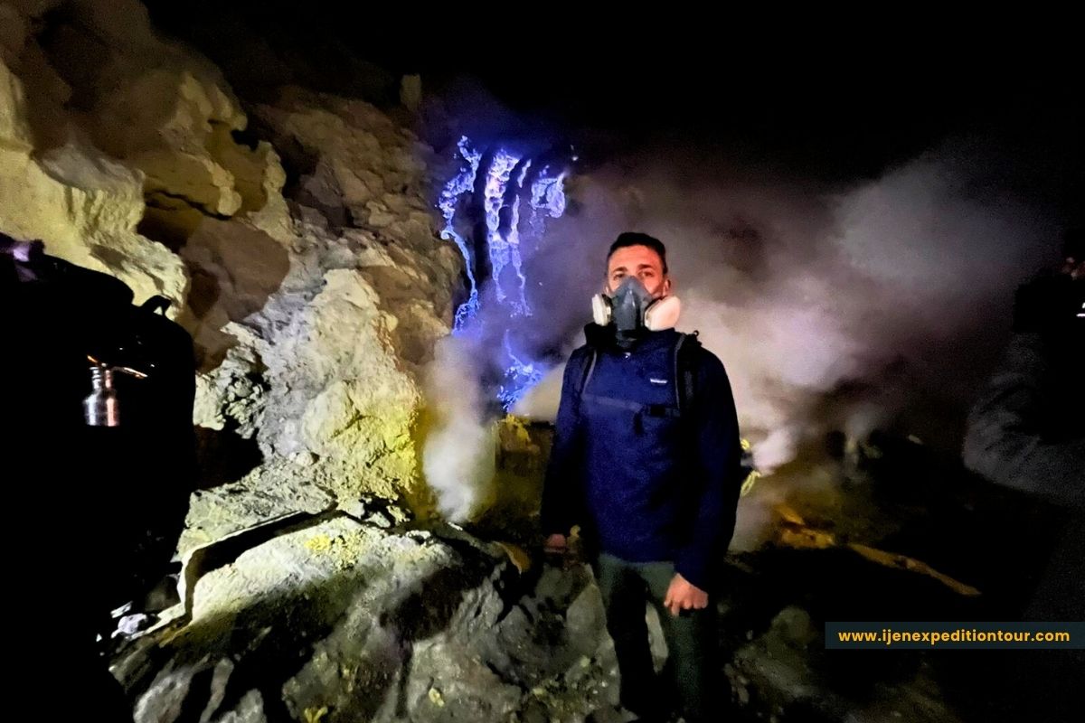 hikers wearing gas masks near sulfur vents at Ijen crater