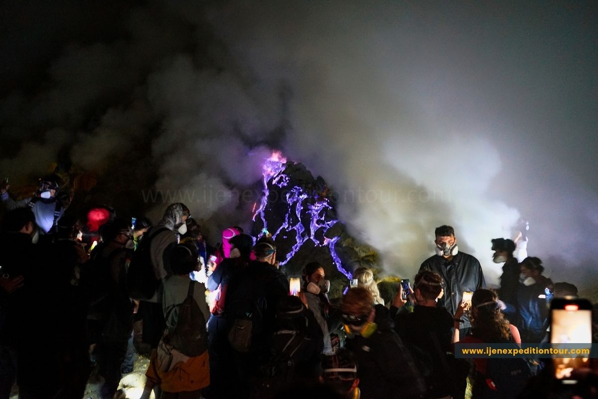 photographer capturing blue flames at Mount Ijen volcano