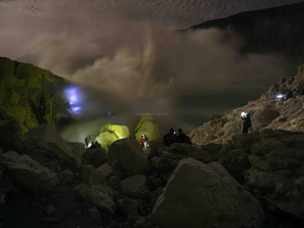 Witnessing the Blue Flames One of the highlights of hiking Mount Ijen is witnessing the mesmerizing blue flames. The blue flames are caused by ignited sulfuric gases that emerge from the volcano's vents. The flames are visible at night and can only be seen when it is dark. To witness the flames, it is necessary to hike up to the volcano's crater, which takes approximately one hour. The hike is challenging, so it is important to take proper precautions and hire a local guide to help navigate the trail. When and where to see the blue flames The blue flames at Mount Ijen are best seen between midnight and dawn. To witness the flames, it is necessary to hike up to the volcano's crater, which takes approximately one hour. It is recommended to hire a local guide to help navigate the trail and ensure your safety. Safety measures and etiquette to follow Since the blue flames are caused by toxic sulfuric gases, it is important to take proper safety measures when witnessing them. It is recommended to wear a gas mask and avoid getting too close to the flames. Additionally, it is important to respect the local culture and follow proper etiquette when visiting the area. Exploring the Crater Lake After witnessing the blue flames, be sure to take some time to explore the beautiful crater lake at the summit of Mount Ijen. The crater lake is a stunning shade of turquoise and is surrounded by breathtaking views of the surrounding landscape. Activities to do at the crater lake include taking a dip in the natural hot springs, taking in the views from the summit, and enjoying a picnic lunch. Conclusion Hiking Mount Ijen is an unforgettable journey that offers adventurers the opportunity to witness one of nature's most mesmerizing spectacles. With proper planning, safety precautions, and the help of a local guide, you can experience the beauty and wonder of Mount Ijen for yourself. Whether you're an experienced hiker or a first-timer, hiking Mount Ijen is a journey that should not be missed.