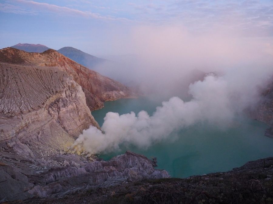 Sunrise at Ijen Crater lake during volcano trekking tour
