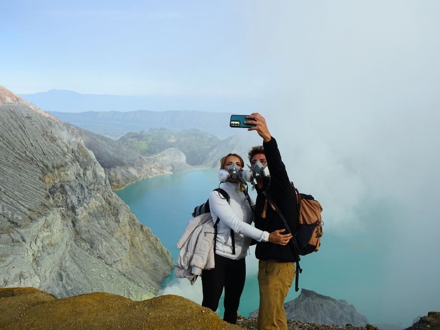 Visitors wearing gas masks during the Ijen Crater Tour