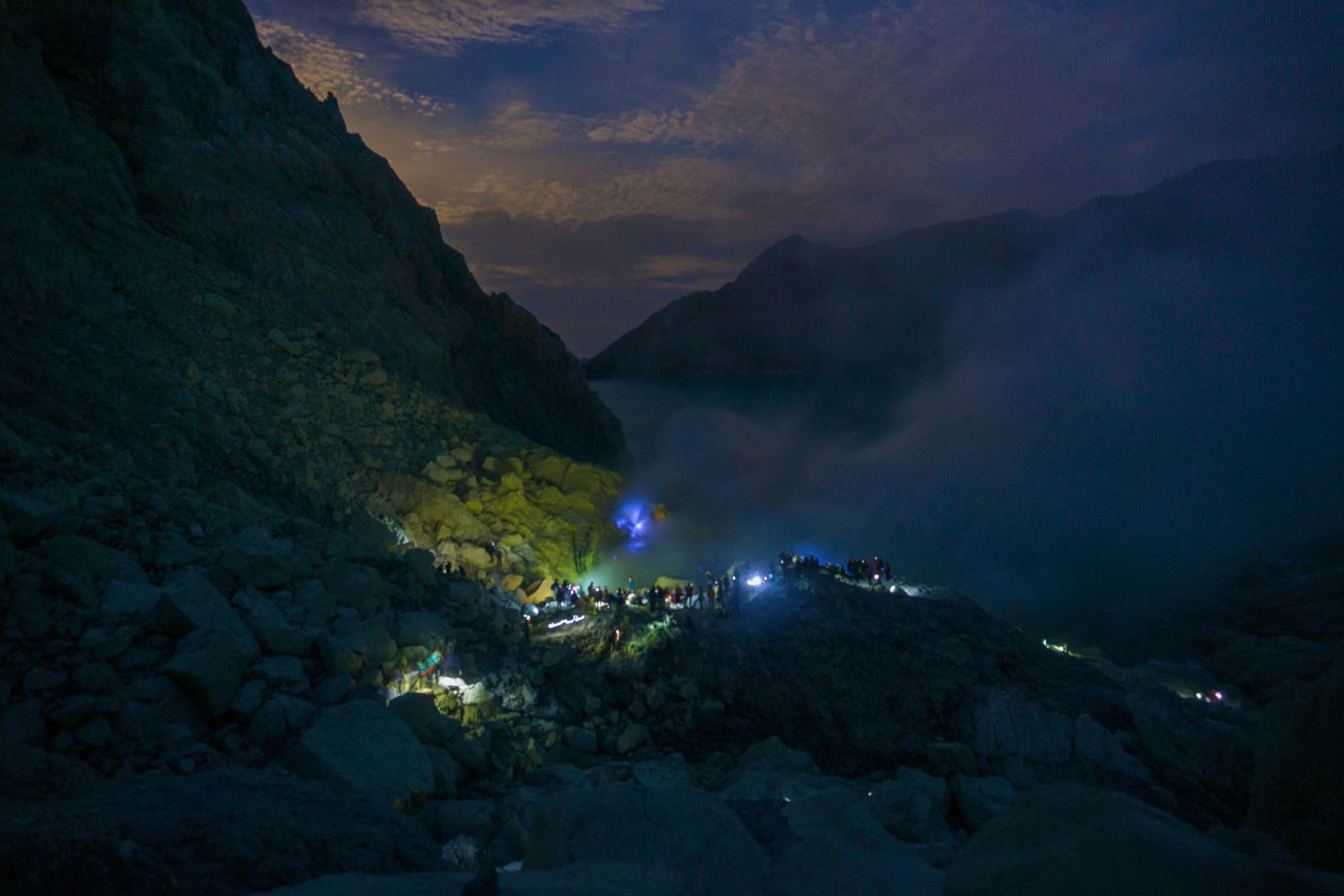 Mount Ijen night tour hikers ascending volcanic trail from Banyuwangi