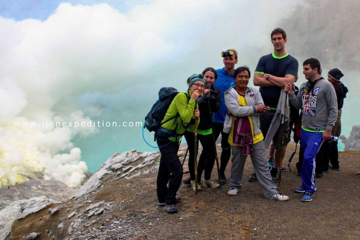 Local volcano guide assisting travelers during Bromo Ijen tour in East Java