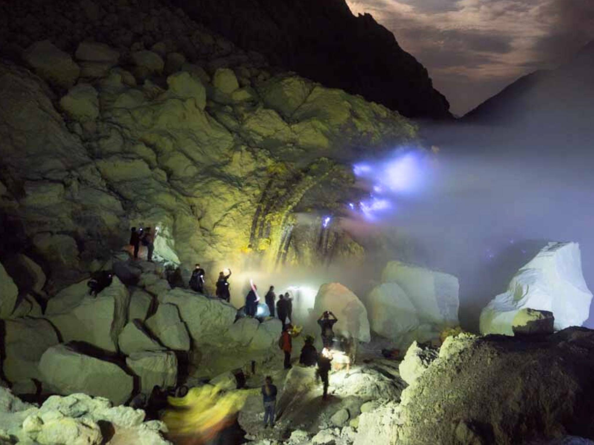 Blue fire phenomenon inside Ijen crater during night hike