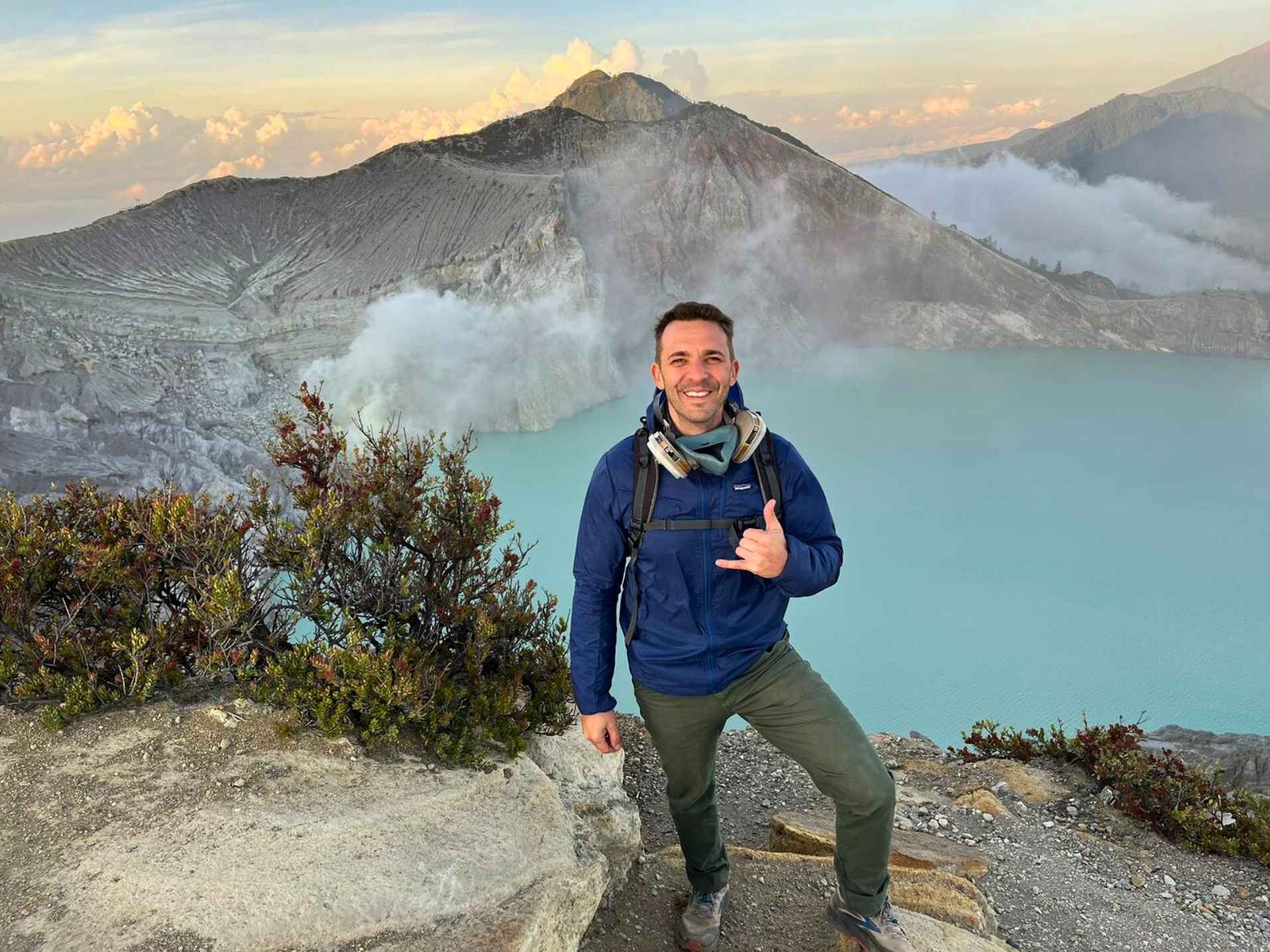 Hikers climbing the steep trail to Ijen Crater during the midnight trek