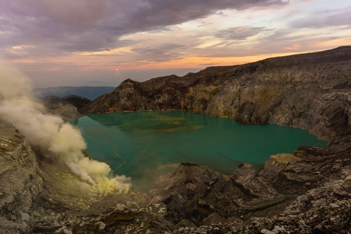 Sunrise view over the turquoise crater lake at Ijen volcano