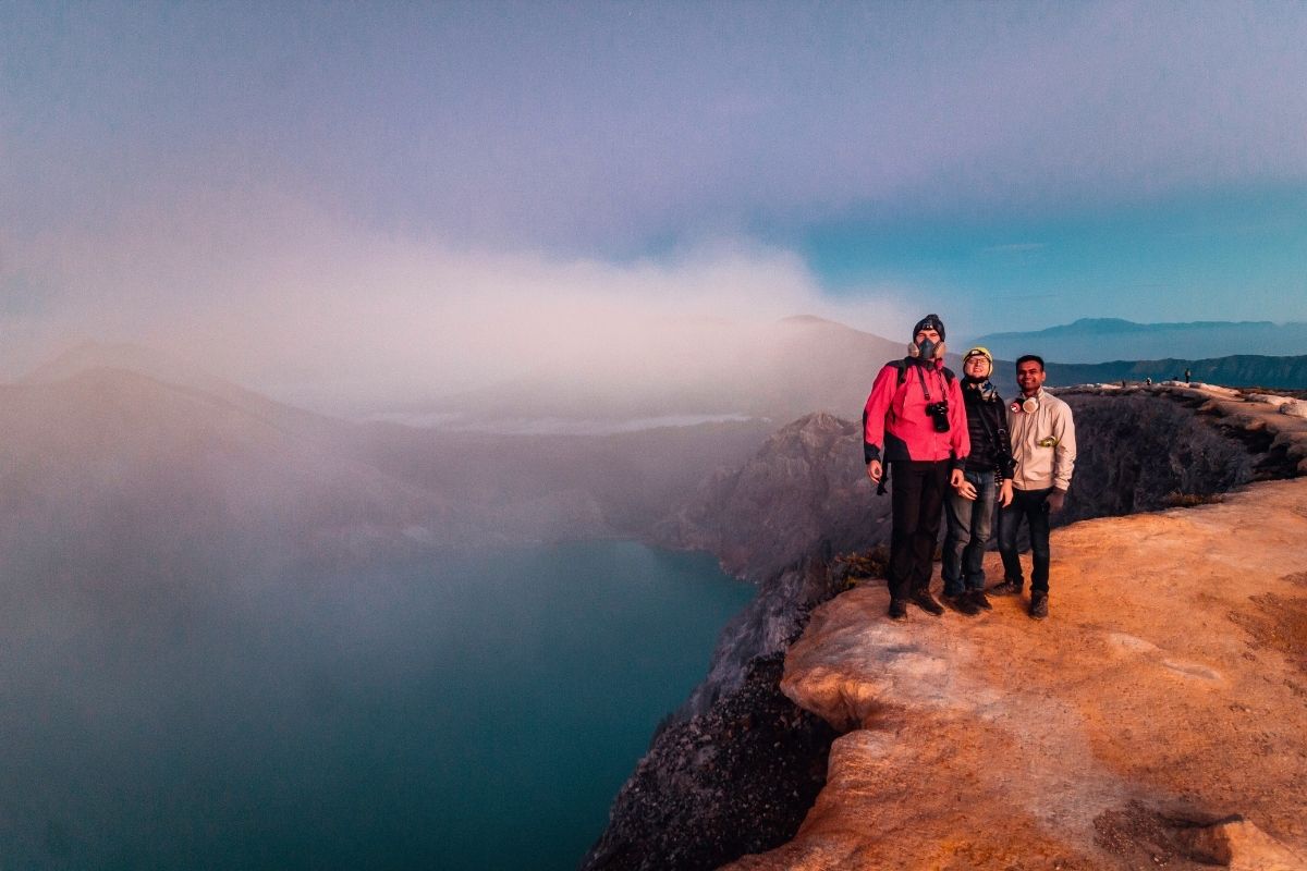 Tourists enjoying sunrise view at Ijen Crater viewpoint